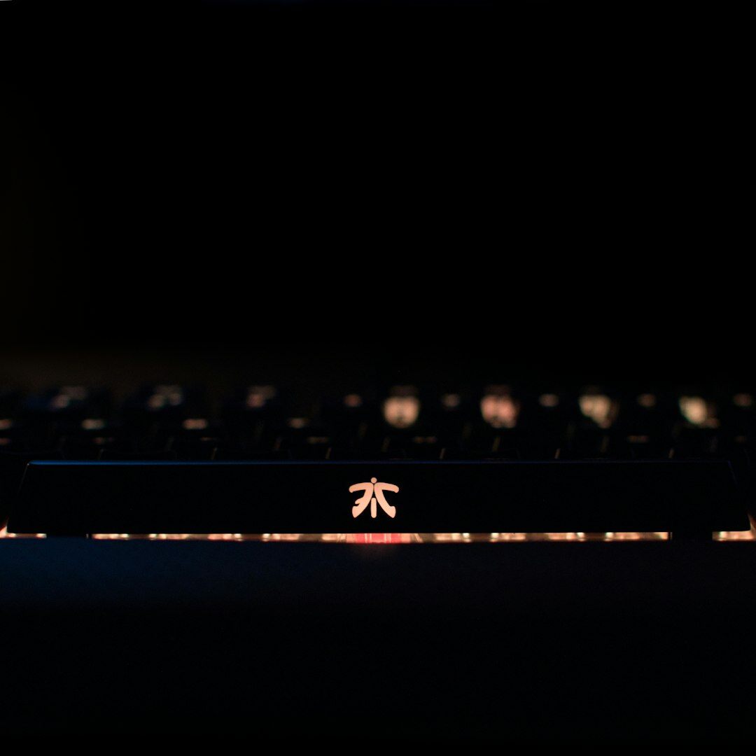 Close-up of an antique black typewriter keys under warm light
