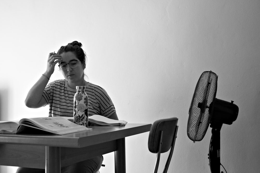 mystery author at desk thinking