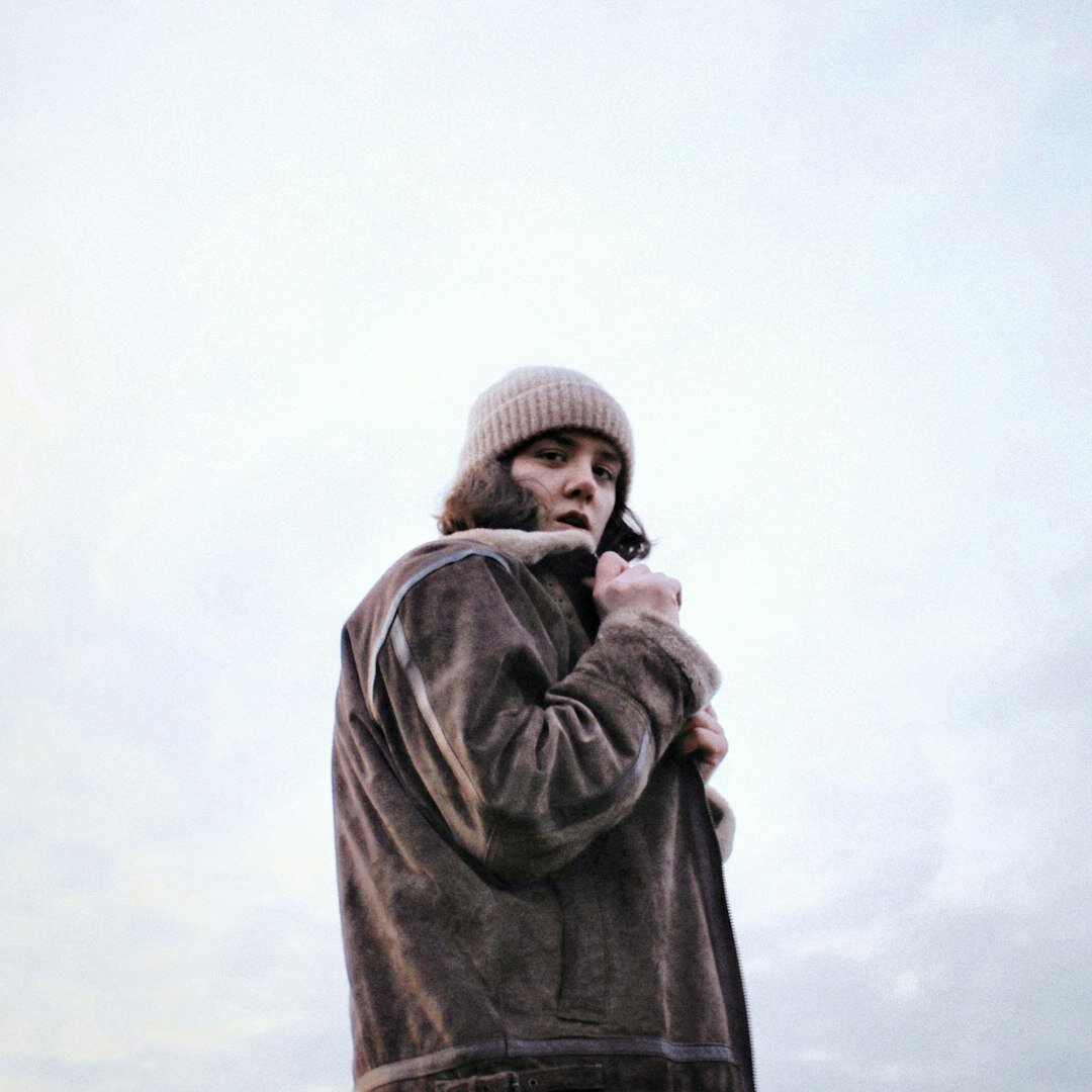 Portrait of a middle-aged Croatian male writer in a dark coat looking thoughtfully at the camera