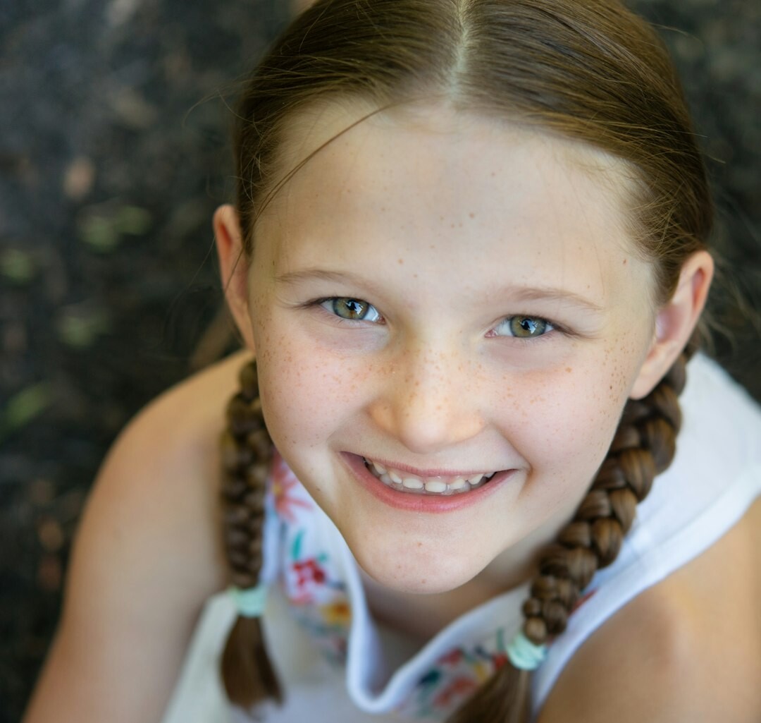 Portrait of a Croatian woman in her thirties smiling softly indoors